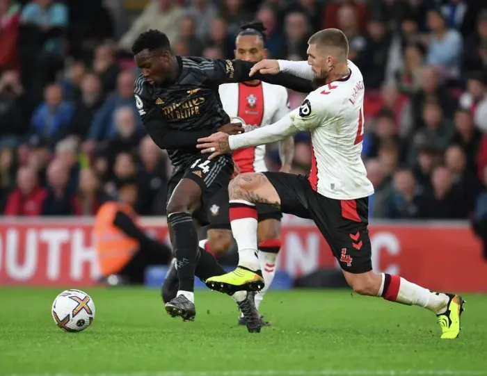 Framed Print : Arsenal's Eddie Nketiah Outmaneuvers Southampton's Lyanco in Premier League Clash