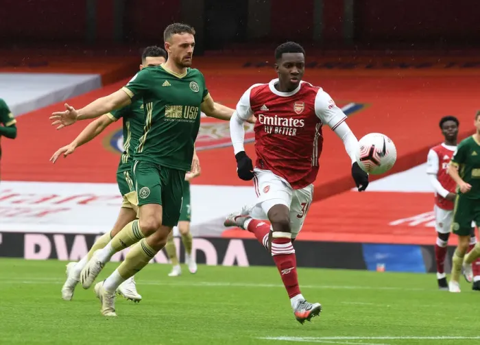 Framed Print : Arsenal's Eddie Nketiah Scores Past Sheffield United's Jack Robinson in Empty Emirates Stadium - Arsenal v Sheffield United, 2020-21 Premier League