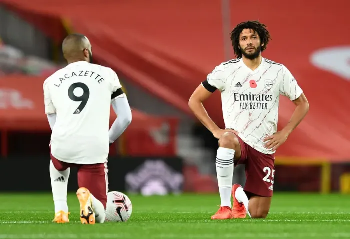 Framed Print : Arsenal's Elneny Kneels at Empty Old Trafford in Manchester United vs Arsenal (2020-21)