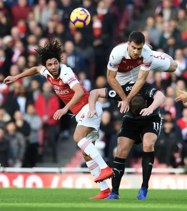 Framed Print : Arsenal's Elneny and Sokratis Battle it Out Against Chris Wood of Burnley Framed Print : Arsenal's Elneny and Sokratis Battle it Out Against Chris Wood of Burnley