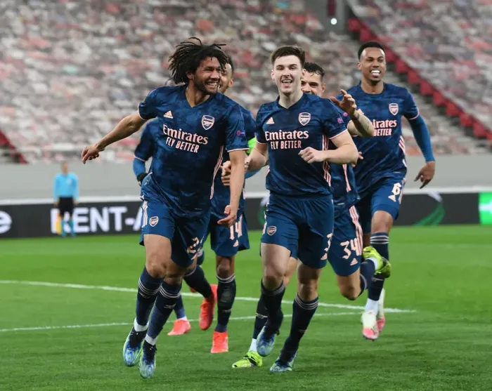 Framed Print : Arsenal's Elneny and Tierney Celebrate Goals in Empty Olympiacos Stadium, Europa League Round of 16