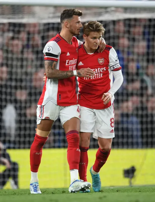 Framed Print : Arsenal's Embrace: Ben White and Martin Odegaard Unite Amidst Chelsea Rivalry