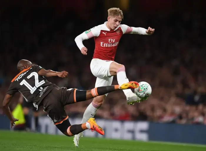 Framed Print : Arsenal's Emile Smith Rowe Clashes with Brentford's Kamohelo Mokotjo in Carabao Cup Showdown Framed Print : Arsenal's Emile Smith Rowe Clashes with Brentford's Kamohelo Mokotjo in Carabao Cup Showdown