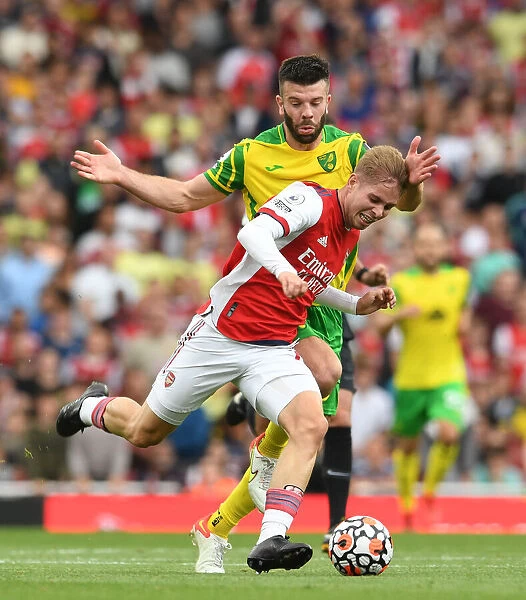 Arsenal's Emile Smith Rowe Clashes with Norwich's Grant Hanley in Premier League Showdown
