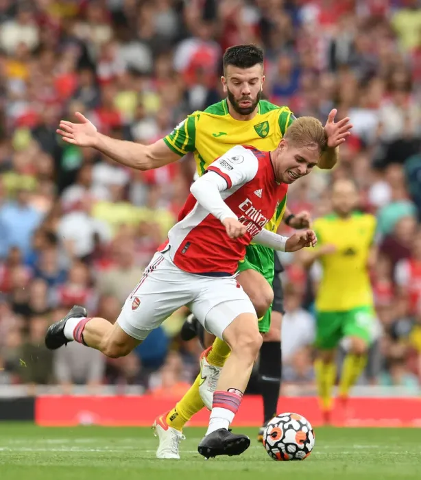 Framed Print : Arsenal's Emile Smith Rowe Clashes with Norwich's Grant Hanley in Premier League Showdown