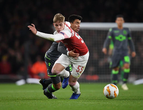 Arsenal's Emile Smith Rowe Clashes with Sporting CP's Marcos Acuna in Europa League Showdown