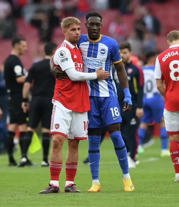 Framed Print : Arsenal's Emile Smith Rowe and Danny Welbeck Embrace Post-Match at Emirates Stadium (Arsenal v Brighton & Hove Albion, 2022-23)