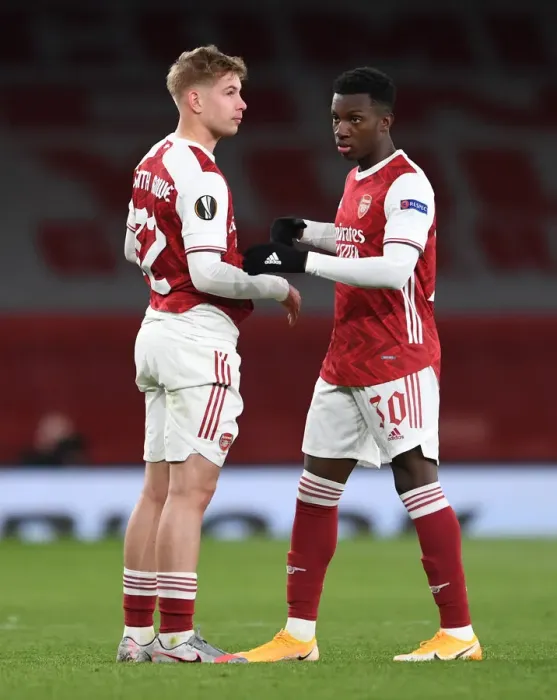 Framed Print : Arsenal's Emile Smith Rowe and Eddie Nketiah Celebrate Semi-Final Advancement vs. Villarreal in Empty Emirates Stadium