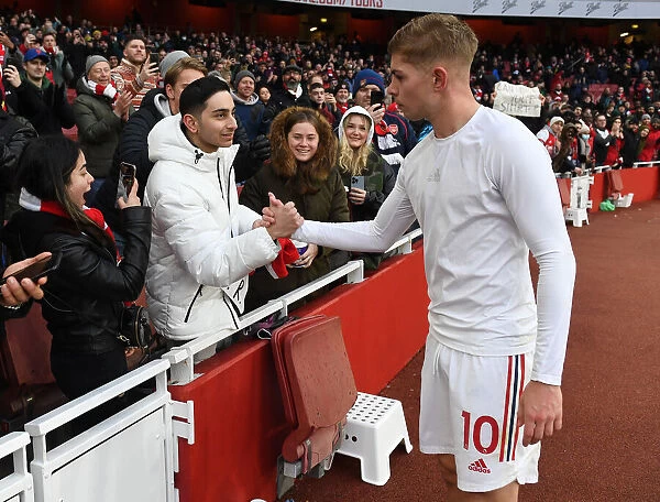 Arsenal's Emile Smith Rowe Greets Fans with Shirt after Arsenal v Newcastle United Match (2021-22)