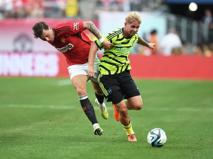 Framed Print : Arsenal's Emile Smith Rowe vs Manchester United's Victor Lindelof: A Pre-Season Face-Off at MetLife Stadium (2023)