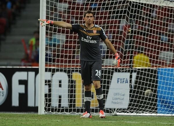 Arsenal's Emiliano Martinez in Action against Singapore XI at Singapore National Stadium (July 2015)