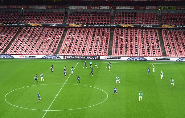 Arsenal's Emirates Stadium: A Ghostly Arena in UEFA Europa League Match Against Rapid Wien (2020-21)