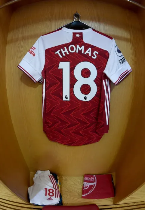 Framed Print : Arsenal's Empty Emirates: Thomas Partey's Hanging Shirt in the Silent Arena (Arsenal v Leicester City, 2020-21)