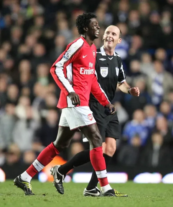 Framed Print : Arsenals Emmanuel Adebayor shares a joke with referee Mike Dean
