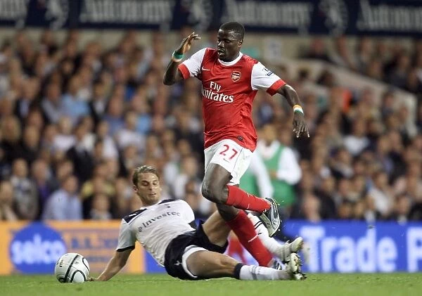 Arsenal's Emmanuel Eboue and David Bentley Clash in Intense Carling Cup Rivalry: Arsenal 4-1 Tottenham (AET)