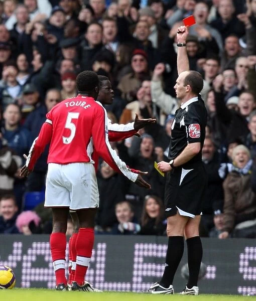 Arsenal's Emmanuel Eboue Receives Red Card from Referee Mike Dean in Barclays Premier League Match against Tottenham Hotspur