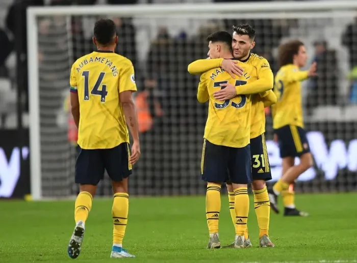 Framed Print : Arsenal's Emotional Victory: Kolasinac Consoles Martinelli After West Ham Clash Framed Print : Arsenal's Emotional Victory: Kolasinac Consoles Martinelli After West Ham Clash
