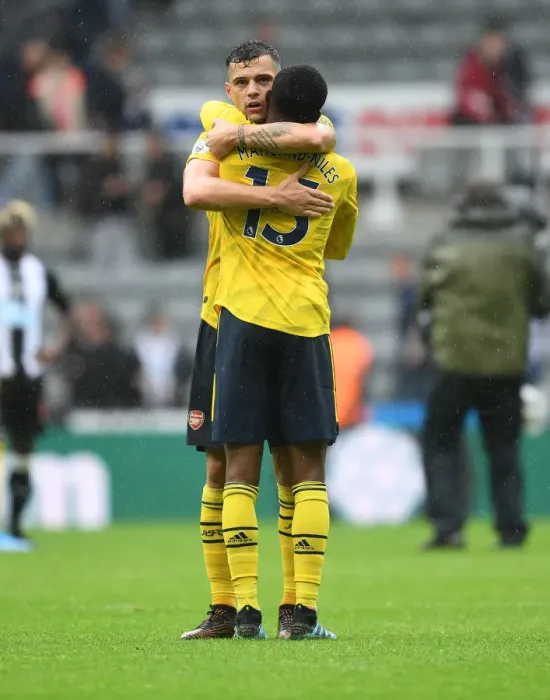 Framed Print : Arsenal's Emotional Victory: Xhaka and Maitland-Niles Embrace Post-Match at Newcastle United Framed Print : Arsenal's Emotional Victory: Xhaka and Maitland-Niles Embrace Post-Match at Newcastle United