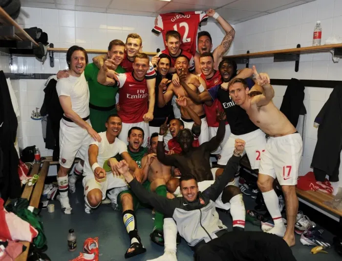 Framed Print : Arsenal's Euphoric Changing Room Celebration: Newcastle United vs Arsenal, Premier League 2012-13