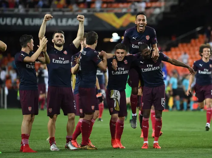 Framed Print : Arsenal's Europa League Victory: Ozil, Kolasinac, Torreira, Aubameyang, and Maitland-Niles Celebrate in Valencia