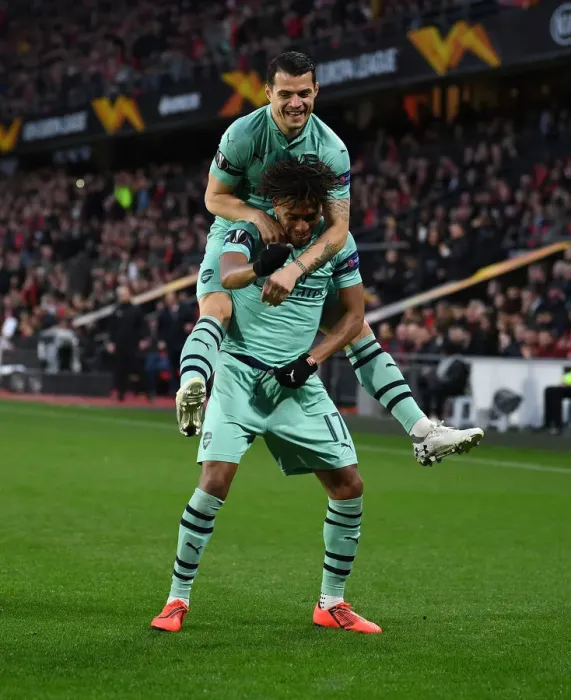 Framed Print : Arsenal's Europa League Victory: Unforgettable Goal Celebration between Iwobi and Xhaka Framed Print : Arsenal's Europa League Victory: Unforgettable Goal Celebration between Iwobi and Xhaka