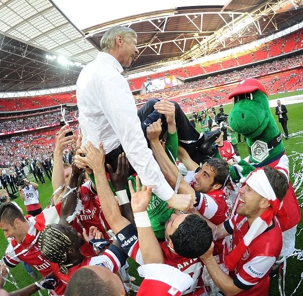 Arsenal's FA Cup Triumph: Wenger Lifted High Amidst Jubilant Players