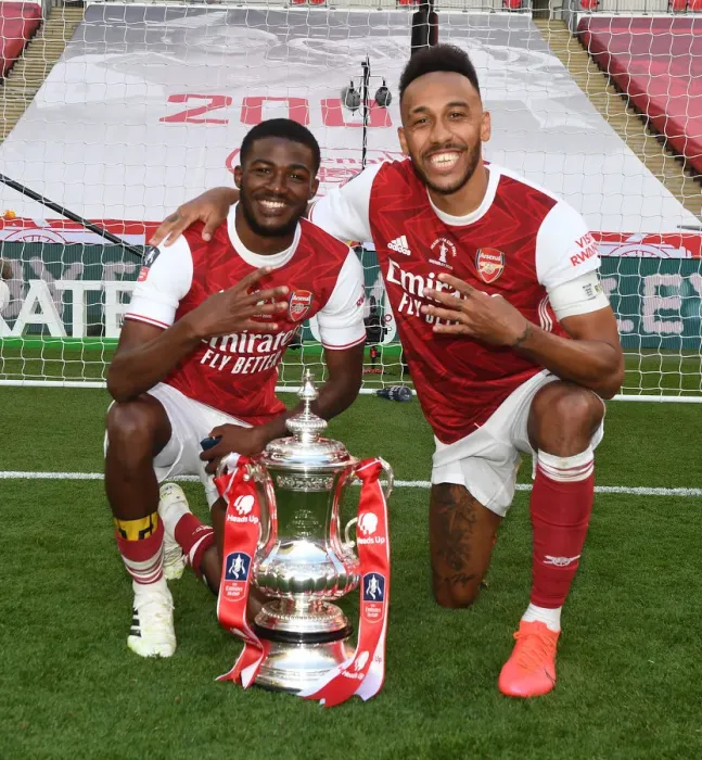 Framed Print : Arsenal's Empty FA Cup Victory: Maitland-Niles and Aubameyang Celebrate at Deserted Wembley (2020) Framed Print : Arsenal's Empty FA Cup Victory: Maitland-Niles and Aubameyang Celebrate at Deserted Wembley (2020)