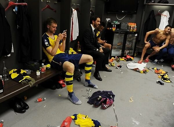 Arsenal's FA Cup Victory: Per Mertesacker and Robert Pires Celebrate with the Trophy