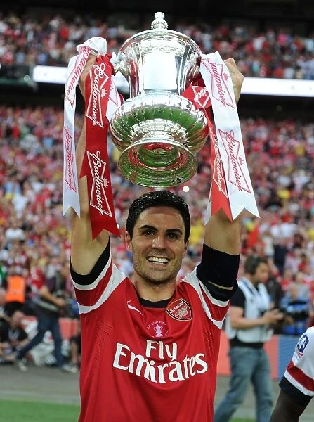 Arsenal's FA Cup Victory: Mikel Arteta Lifts the Trophy after Arsenal vs. Hull City, 2014