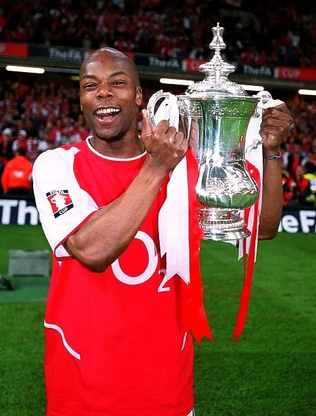 Arsenal's FA Cup Victory: Sylvain Wiltord Lifts the Trophy over Southampton (May 17, 2003)