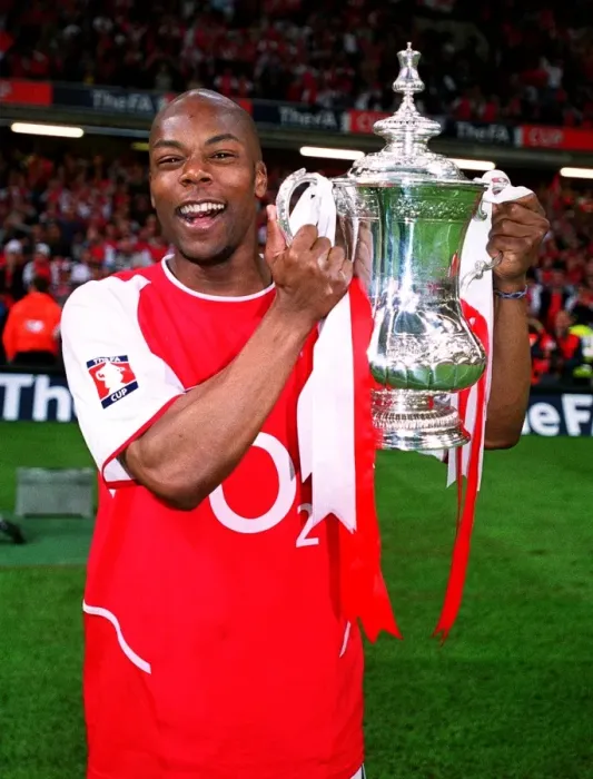 Framed Print : Arsenal's FA Cup Victory: Sylvain Wiltord Lifts the Trophy over Southampton (May 17, 2003)