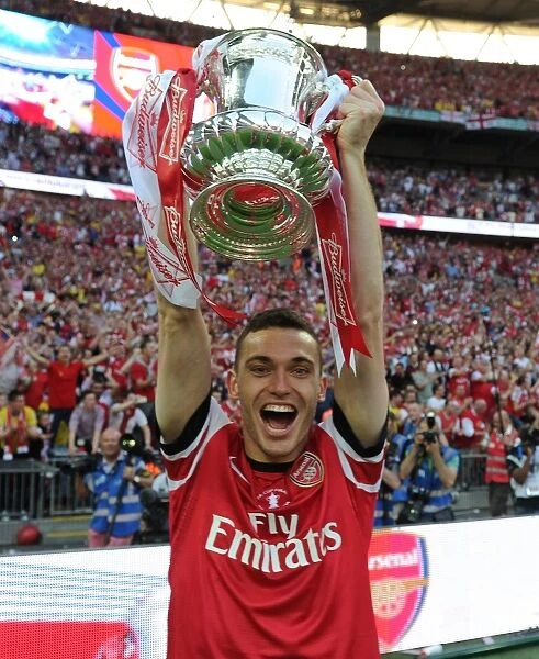 Arsenal's FA Cup Victory: Thomas Vermaelen Lifts the Trophy after Defeating Hull City