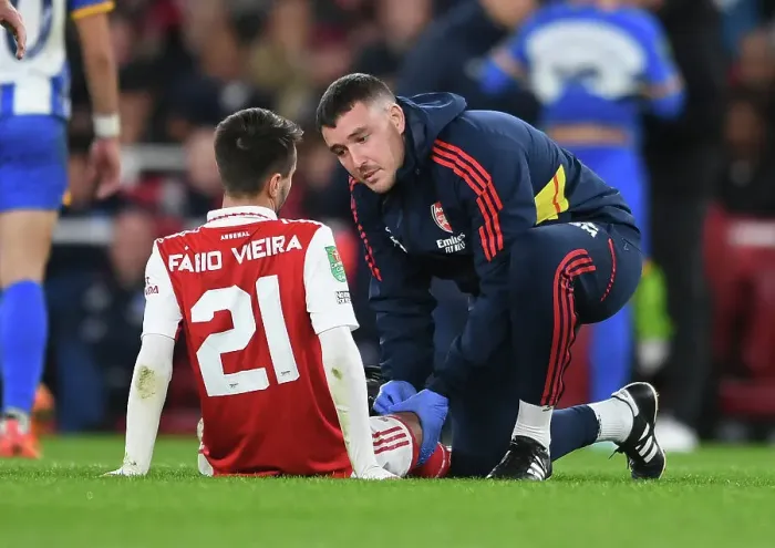 Framed Print : Arsenal's Fabio Vieira Receives Treatment vs Brighton in Carabao Cup