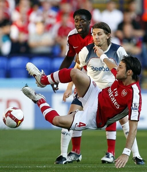 Arsenal's Fabregas Fends Off Bolton: A Premier League Showdown