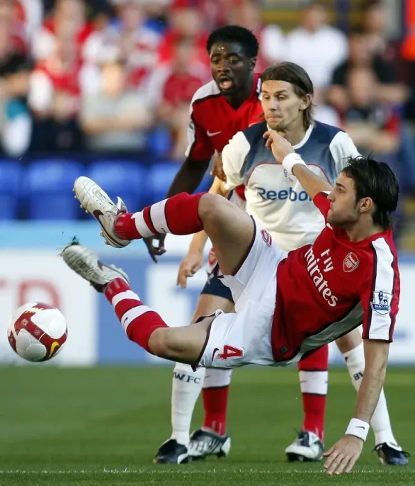 Framed Print : Arsenal's Fabregas Fends Off Bolton: A Premier League Showdown Framed Print : Arsenal's Fabregas Fends Off Bolton: A Premier League Showdown