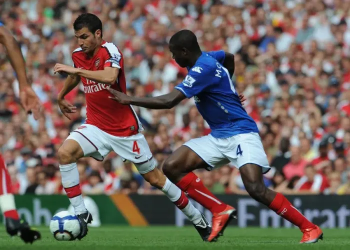 Framed Print : Arsenal's Fabregas Overpowers Mokoena as Gunners Thrash Portsmouth 4-1 Framed Print : Arsenal's Fabregas Overpowers Mokoena as Gunners Thrash Portsmouth 4-1