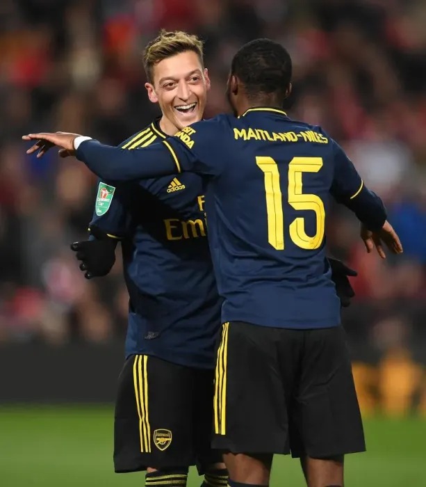 Framed Print : Arsenal's Four-Goal Blitz: Ozil and Maitland-Niles Jubilant Moment at Anfield