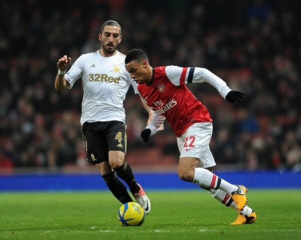 Arsenal's Francis Coquelin Clashes with Swansea's Chico Flores in FA Cup Third Round Replay
