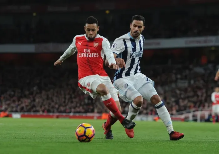 Framed Print : Arsenal's Francis Coquelin Fends Off West Brom's Nacer Chadli in Premier League Clash Framed Print : Arsenal's Francis Coquelin Fends Off West Brom's Nacer Chadli in Premier League Clash