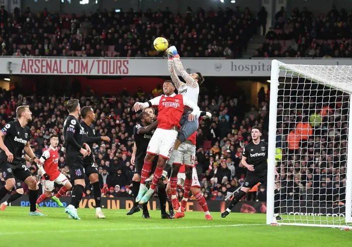 Framed Print : Arsenal's Gabriel Clashes with West Ham's Fabianski in Premier League Showdown