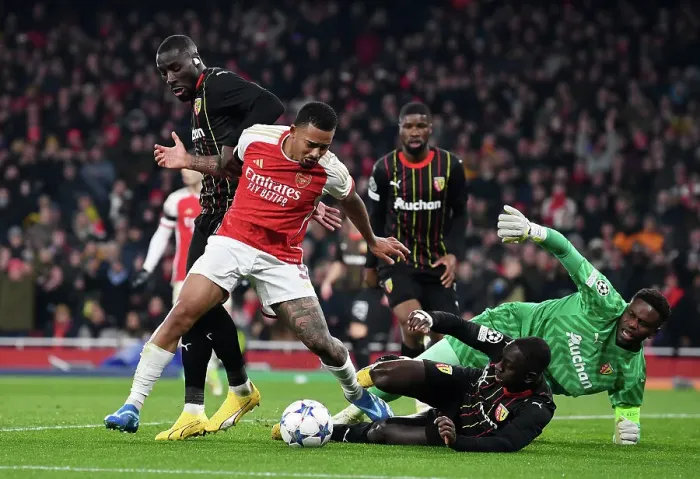 Framed Print : Arsenal's Gabriel Jesus Faces Off Against RC Lens Massadio Haidara in Champions League Group Stage Clash