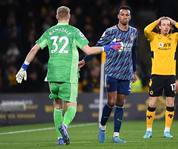 Arsenal's Gabriel Magalhaes and Aaron Ramsdale Celebrate at Molineux: Wolverhampton Wanderers vs. Arsenal, Premier League 2021-22