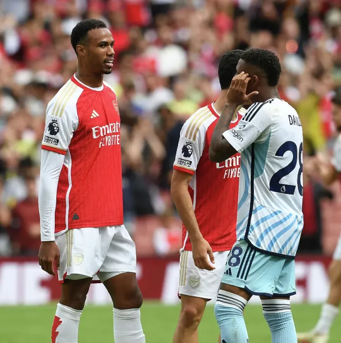 Framed Print : Arsenal's Gabriel Magalhaes and Nottingham Forest's Danilo Share a Moment After 2023-24 Premier League Encounter