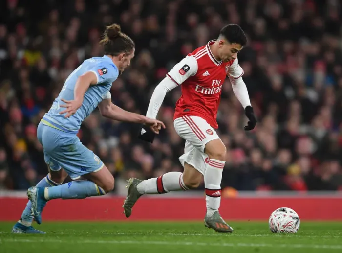 Framed Print : Arsenal's Gabriel Martinelli Clashes with Leeds Luke Ayling in FA Cup Showdown Framed Print : Arsenal's Gabriel Martinelli Clashes with Leeds Luke Ayling in FA Cup Showdown