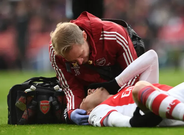 Framed Print : Arsenal's Gabriel Martinelli Receives Medical Attention during Arsenal vs Newcastle United (Premier League 2021-22)
