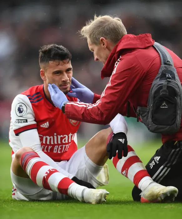 Framed Print : Arsenal's Gabriel Martinelli Receives Medical Attention During Arsenal vs Newcastle United (Premier League 2021-22)