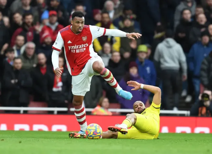 Framed Print : Arsenal's Gabriel Outmuscles Brentford's Mbeumo in Premier League Clash