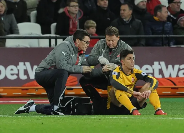Framed Print : Arsenal's Gabriel Receives Treatment from Medical Team During West Ham Match Framed Print : Arsenal's Gabriel Receives Treatment from Medical Team During West Ham Match