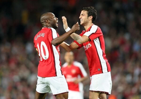 Arsenal's Gallas and Fabregas Celebrate Double Strike against FC Twente in Champions League