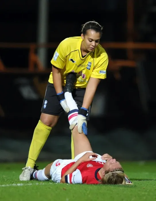 Framed Print : Arsenal's Gilly Flaherty Receives Medical Attention from Birmingham's Rebecca Spencer during FA WSL Continental Cup Final Framed Print : Arsenal's Gilly Flaherty Receives Medical Attention from Birmingham's Rebecca Spencer during FA WSL Continental Cup Final